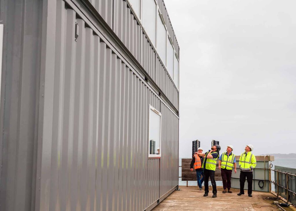 installation team inspect container positioning